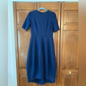 Minimalist COS navy blue dress made out of wool blend.